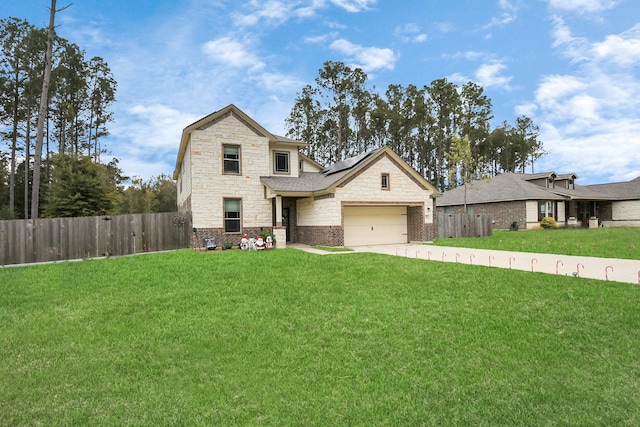 view of front of house with a front lawn, a garage, and solar panels