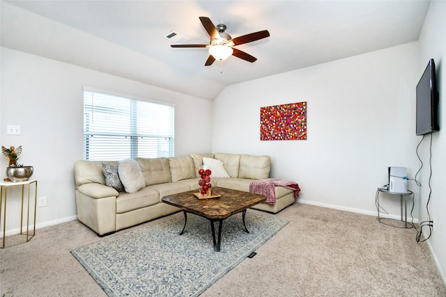 living area with visible vents, vaulted ceiling, light colored carpet, and baseboards