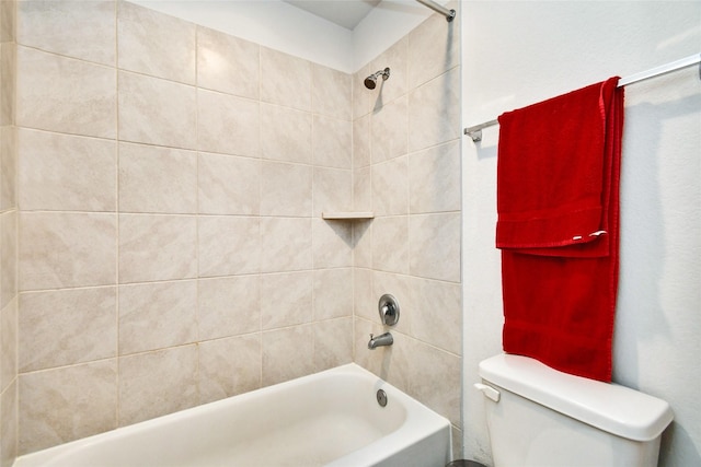 bathroom featuring shower / tub combination and toilet