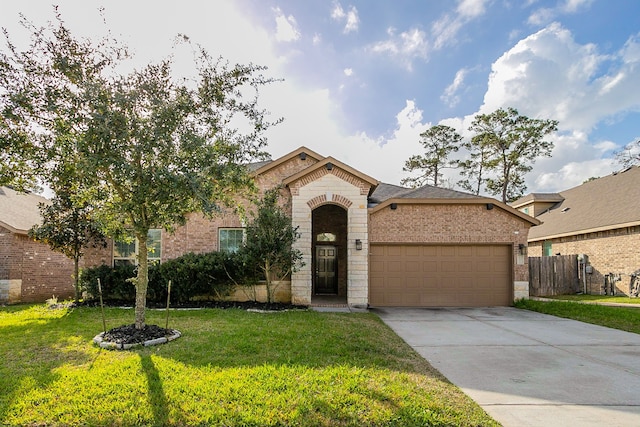 view of front of home with a front lawn and a garage