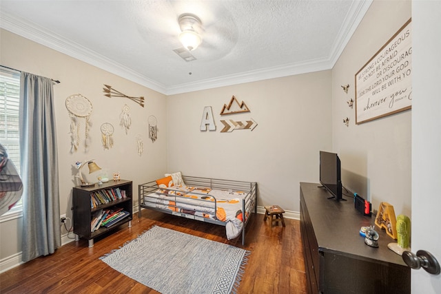 bedroom featuring a textured ceiling, dark hardwood / wood-style flooring, ceiling fan, and crown molding