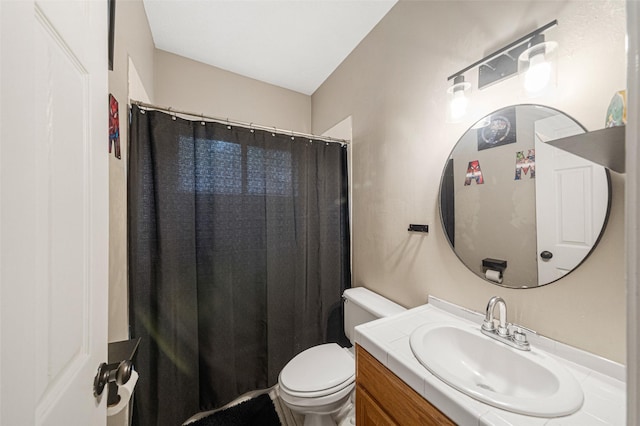 bathroom with a shower with curtain, vanity, and toilet