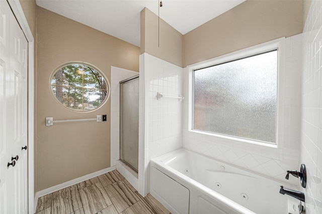 bathroom with separate shower and tub