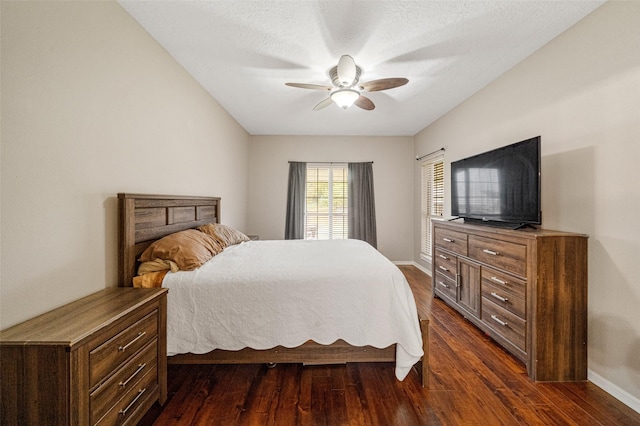 bedroom featuring a textured ceiling, dark hardwood / wood-style flooring, and ceiling fan