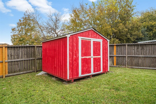 view of outdoor structure with a lawn