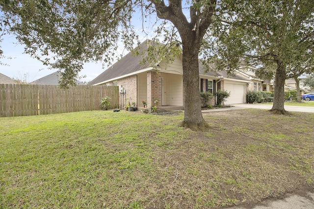 view of front of house with a front yard and a garage