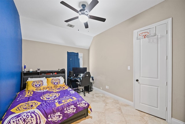 tiled bedroom featuring ceiling fan and vaulted ceiling