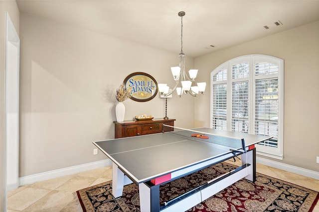 rec room with light tile patterned floors and a notable chandelier