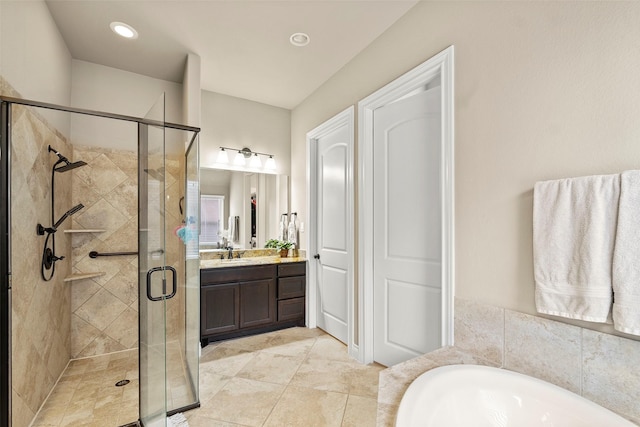 bathroom featuring tile patterned flooring, vanity, and plus walk in shower