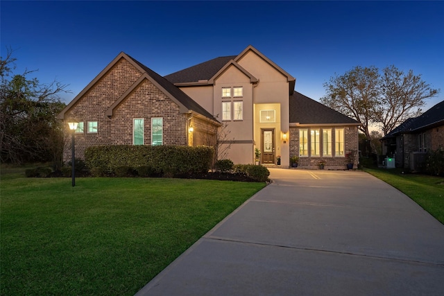 view of front of house with a yard