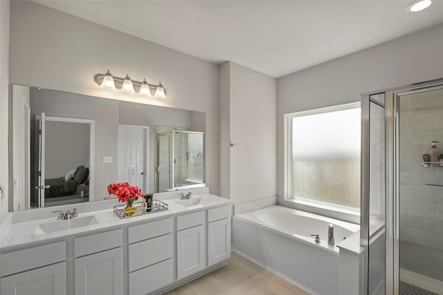 bathroom with vanity and plus walk in shower