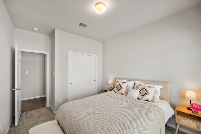 carpeted bedroom featuring a closet