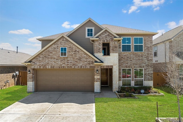 front of property with a front yard and a garage