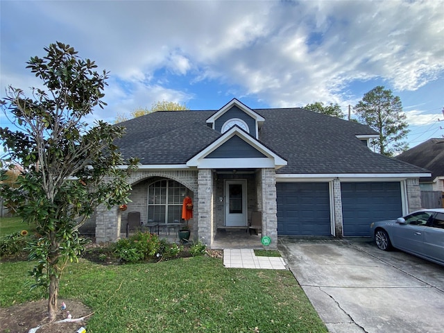 view of front facade with a front lawn, a porch, and a garage