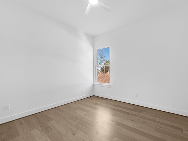 spare room featuring ceiling fan and light hardwood / wood-style flooring