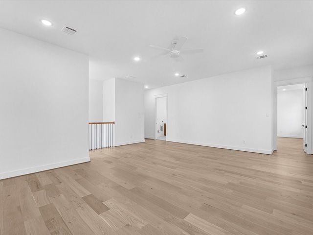 unfurnished room featuring ceiling fan and light wood-type flooring