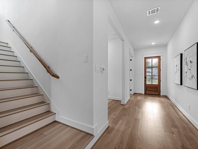 entryway with light hardwood / wood-style floors