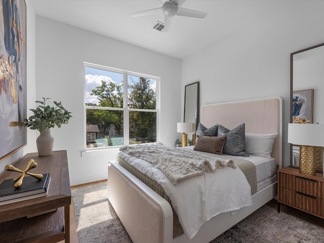 bedroom with hardwood / wood-style floors and ceiling fan