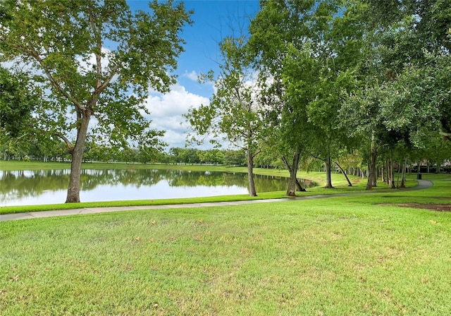 exterior space featuring a yard and a water view