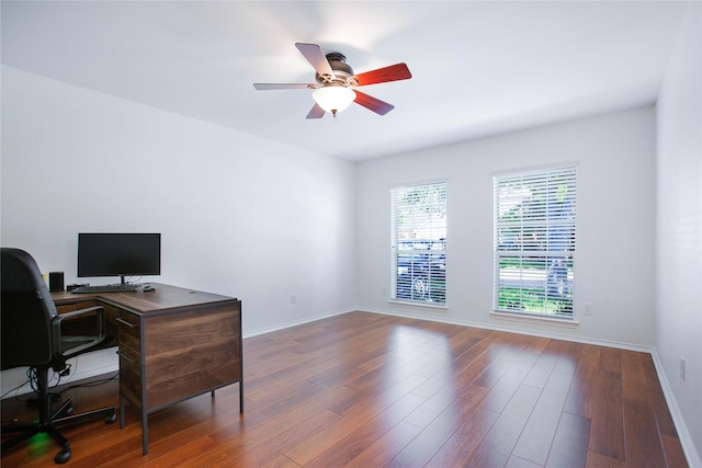 office space with dark hardwood / wood-style floors and ceiling fan