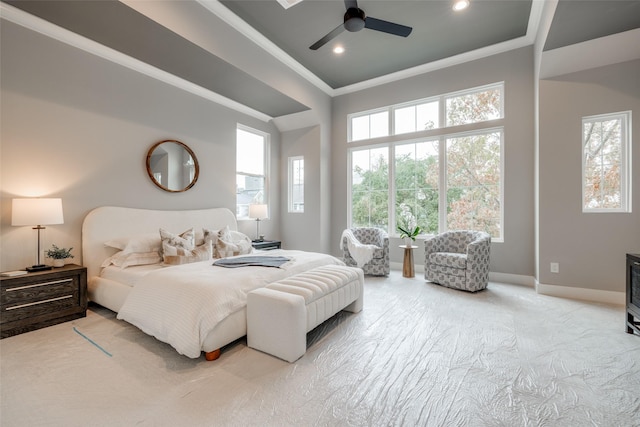 carpeted bedroom with ceiling fan and crown molding