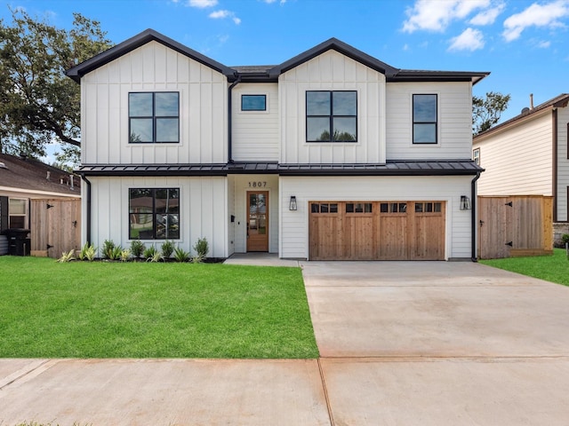 modern farmhouse with a garage and a front lawn