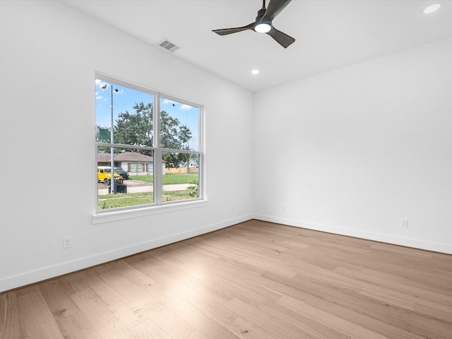 spare room featuring ceiling fan and light wood-type flooring