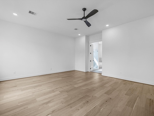 empty room featuring ceiling fan and light wood-type flooring