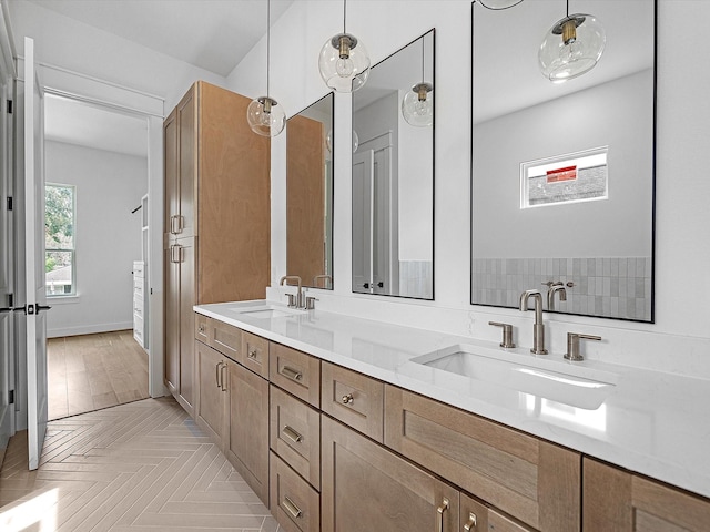 bathroom with parquet flooring and vanity