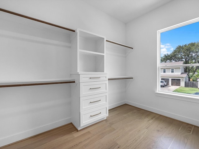 walk in closet featuring light wood-type flooring