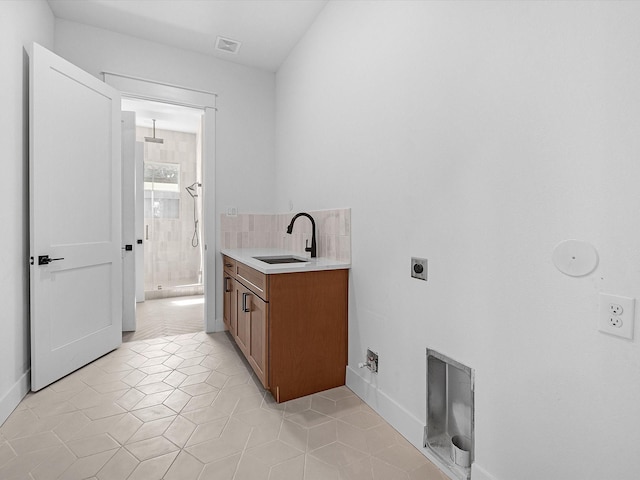 bathroom featuring vanity, tile patterned floors, and a shower with door