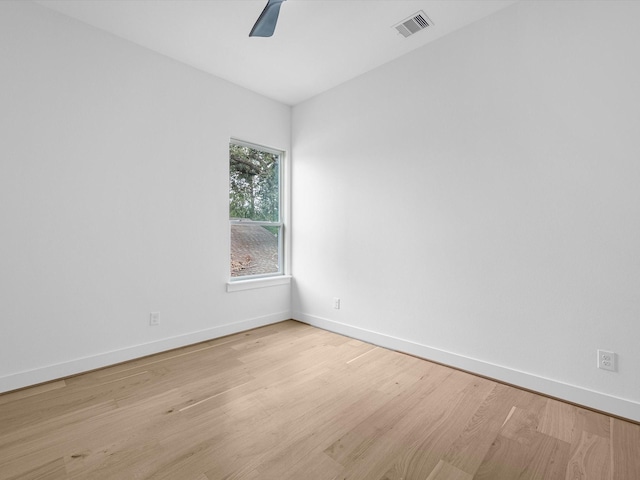 unfurnished room with light hardwood / wood-style floors