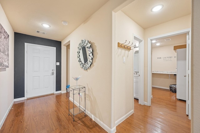 hallway featuring hardwood / wood-style flooring