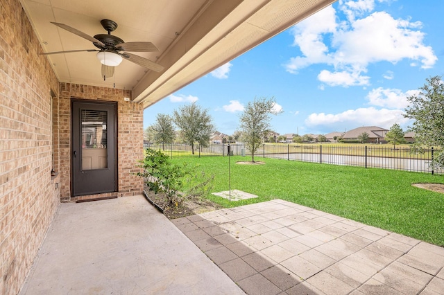 exterior space featuring a yard, a patio, and ceiling fan