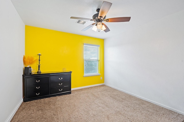 unfurnished bedroom with carpet floors and ceiling fan