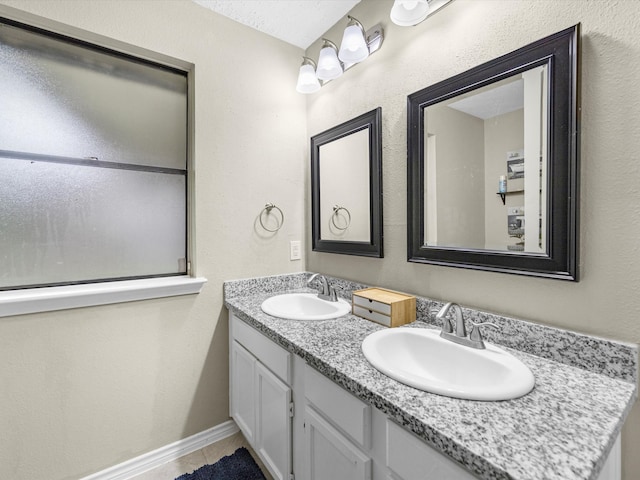 bathroom with vanity and tile patterned floors