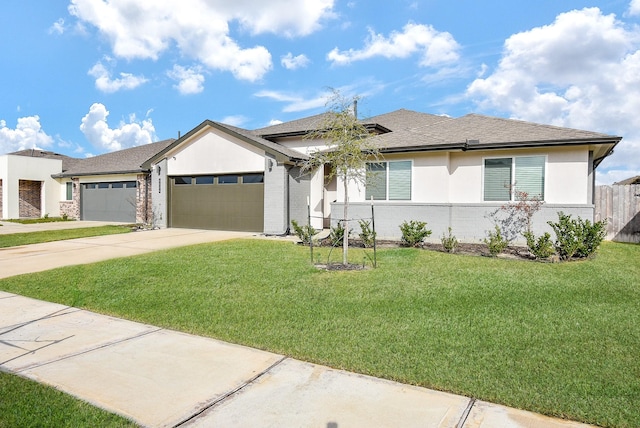 view of front of home featuring a garage and a front yard