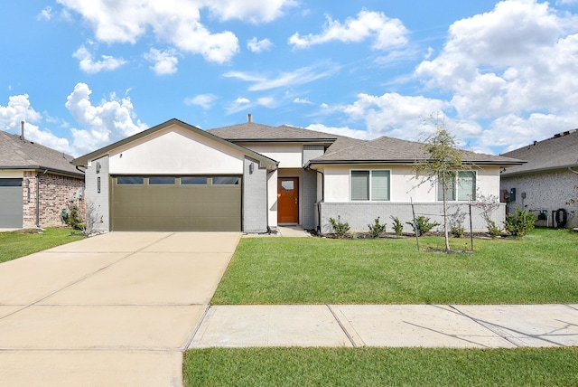 view of front facade featuring a front yard and a garage