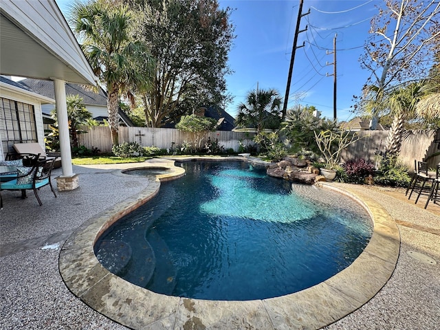 view of swimming pool with a patio