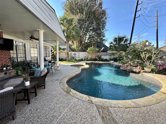 view of pool featuring ceiling fan and a patio