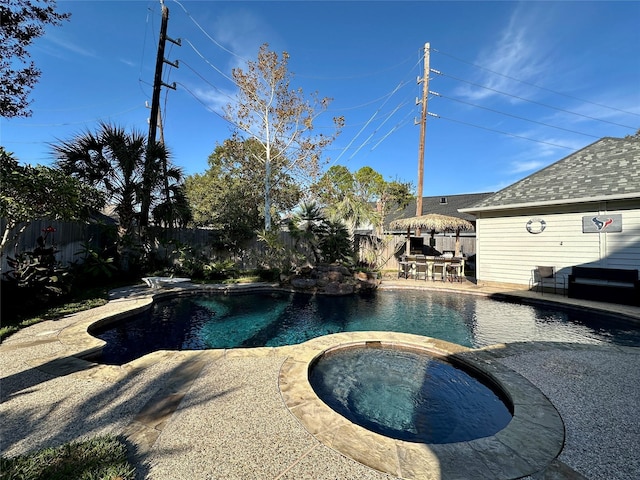 view of pool featuring an in ground hot tub and a patio