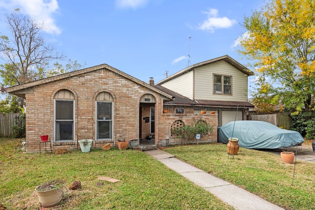 view of front of property featuring a front lawn and a garage