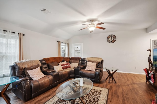 living room with dark hardwood / wood-style floors, a healthy amount of sunlight, lofted ceiling, and ceiling fan