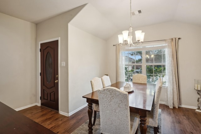 dining room featuring vaulted ceiling, dark hardwood / wood-style floors, and a notable chandelier