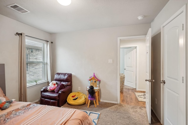 bedroom with light hardwood / wood-style floors