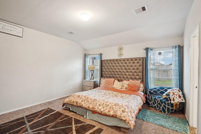 carpeted bedroom featuring vaulted ceiling