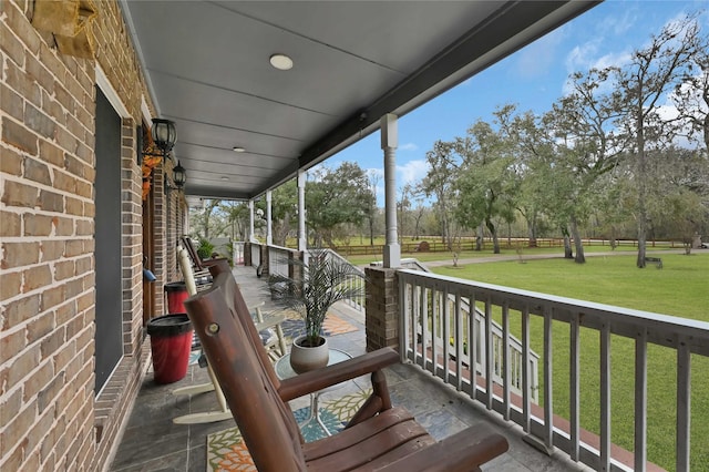 balcony featuring a porch