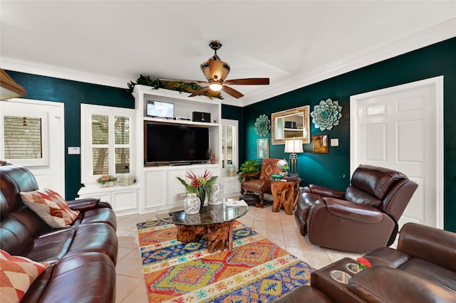 tiled living room with ceiling fan and ornamental molding