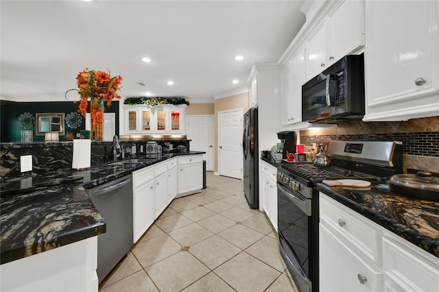 kitchen with decorative backsplash, sink, white cabinets, and black appliances