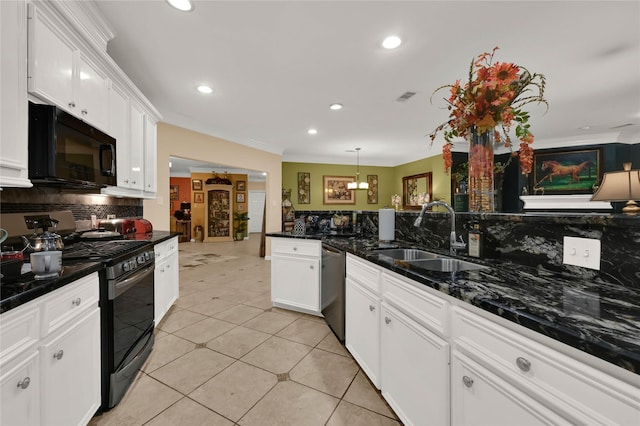 kitchen with pendant lighting, appliances with stainless steel finishes, sink, white cabinetry, and light tile patterned floors